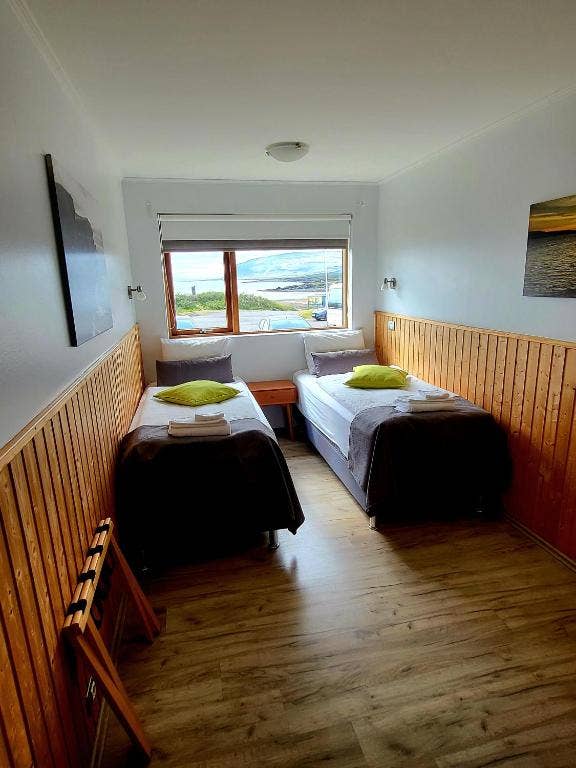 Enjoy the best of both worlds in the twin room at Hotel Flokalundur – a comfortable retreat and panoramic views.