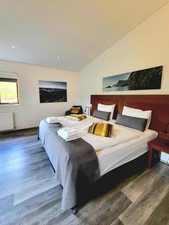 The inviting coziness of Hotel Flokalundur's comfy room ensures a delightful and restful experience.