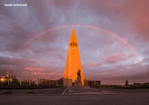 Hallgrimskirkja church is a beautiful monument, pictured under a rainbow.