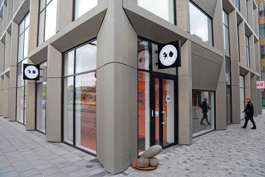 Exterior view of the Icelandic Phallological Museum entrance at Hafnartorg in downtown Reykjavik, showing the museum's circular logo signs on the corner of a modern glass and concrete building. Exterior view of the Icelandic Phallological Museum entrance at Hafnartorg in downtown Reykjavik, showing the museum's circular logo signs on the corner of a modern glass and concrete building.