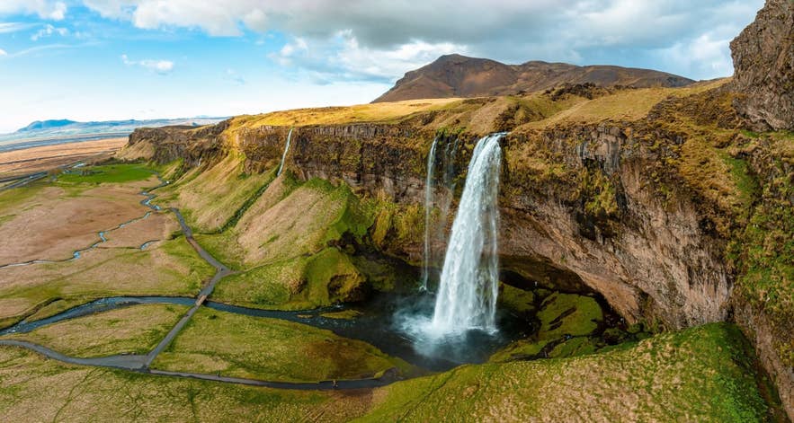 Seljalandsfoss waterfall in Iceland with lush landscape and flowing water