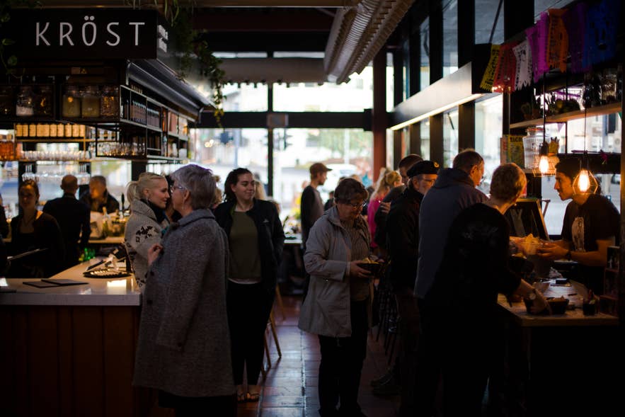 Kröst restaurant at Hlemmur Mathöll Reykjavik with diners enjoying Icelandic food in a lively food hall atmosphere