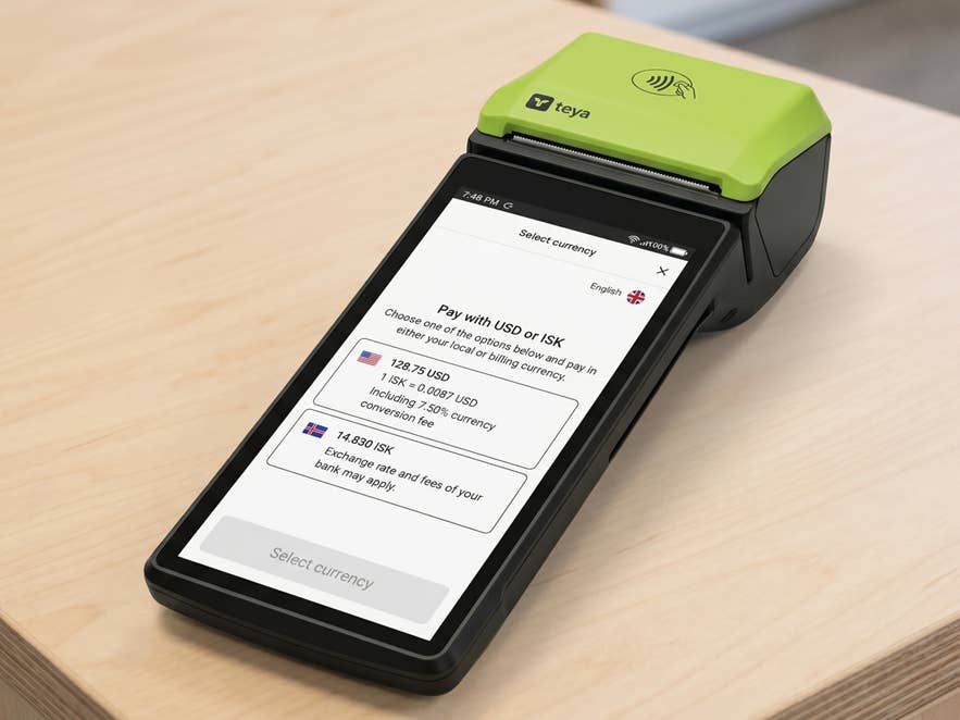 Card payment terminal showing options to pay in USD or ISK in Iceland.