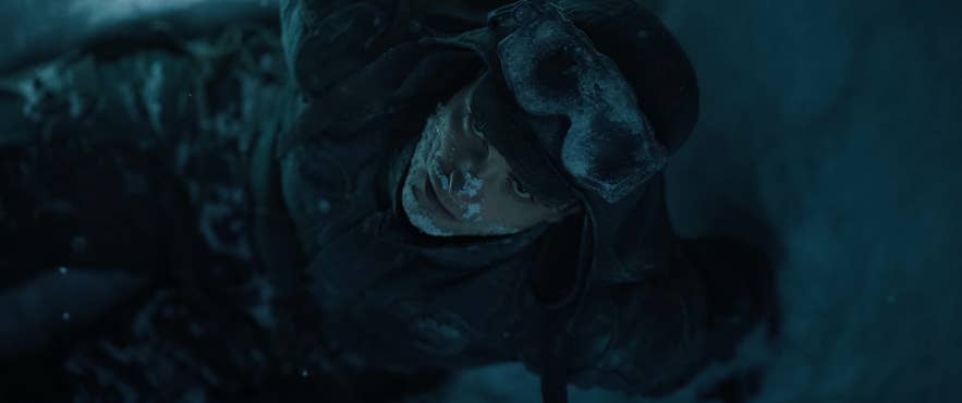 Character inside blue ice cave filmed in Iceland for Mickey 17 movie in 2025.