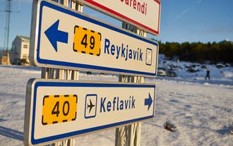Road sign showing Reykjavik and Keflavik directions along Iceland route.