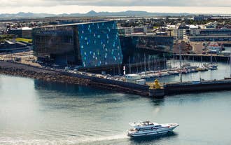 Aerial view of Harpa Concert Hall and the Reykjavik harbor cruise vessel.