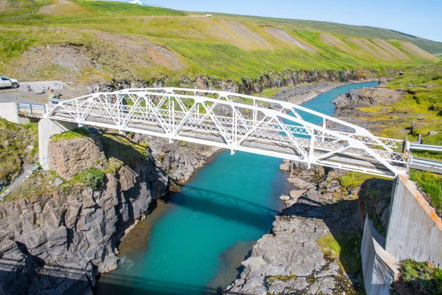 Jokuldalur Bridge spanning a turquoise glacial river in the rugged highlands of Iceland
