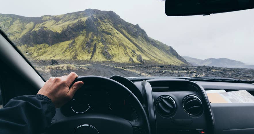 View from the driver's seat of a road leading to Landmannalaugar in the Icelandic Highlands.