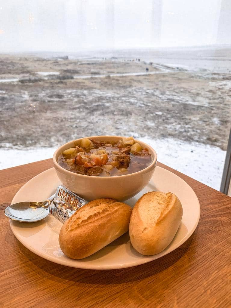 A bowl of hearty lamb stew served with bread rolls at Gullfoss Cafe Restaurant on the Golden Circle in Iceland.