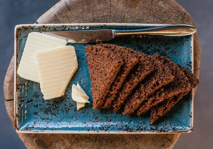 Traditional Icelandic hverabraud, a dense geothermally baked rye bread, served with butter at Laugarvatn Fontana on the Golden Circle.