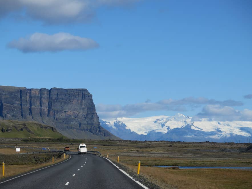 Ring Road road trip near Lomagnupur mountain with Vatnajokull glacier in South Iceland background Ring Road road trip near Lomagnupur mountain with Vatnajokull glacier in South Iceland background