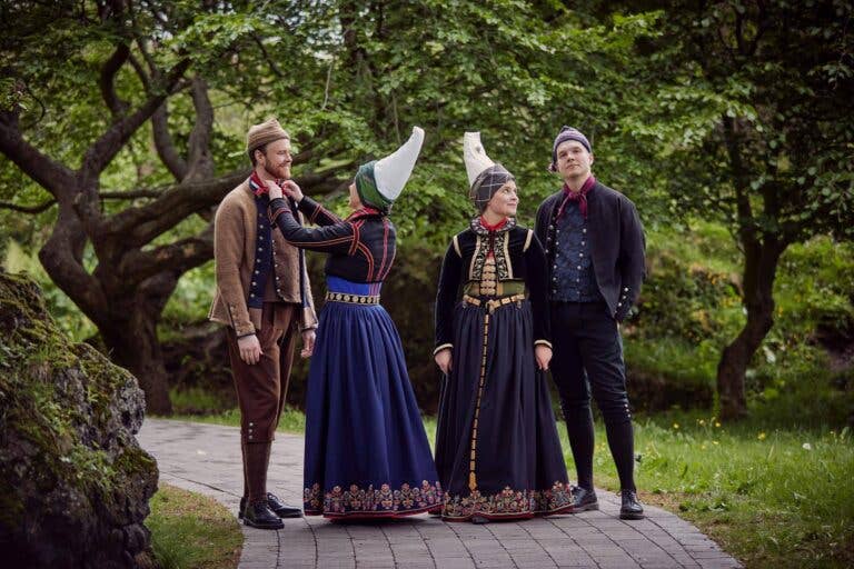 Group wearing Icelandic national costumes at a cultural gathering in Hafnarfjordur, including skautbúningur and men’s dress Group wearing Icelandic national costumes at a cultural gathering in Hafnarfjordur, including skautbúningur and men’s dress