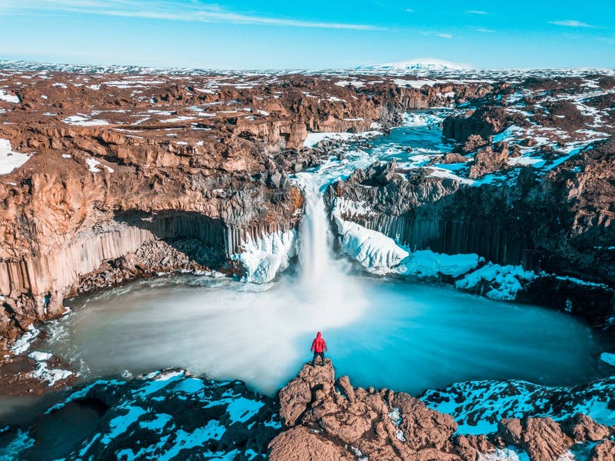Aldeyjarfoss Waterfall plunging into a canyon framed by basalt columns in North Iceland.