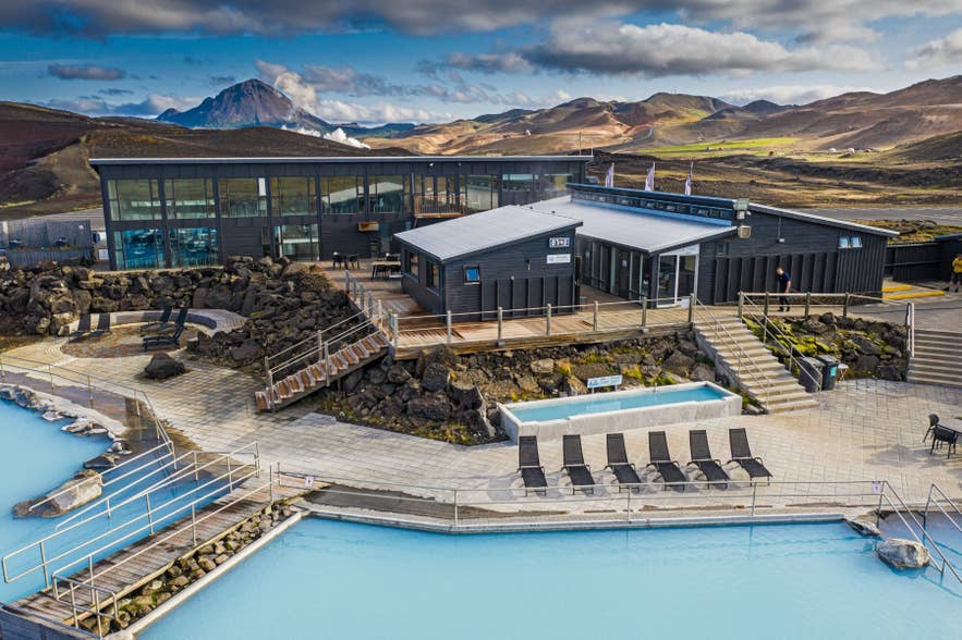 Aerial view of Earth Lagoon surrounded by lava fields in North Iceland.