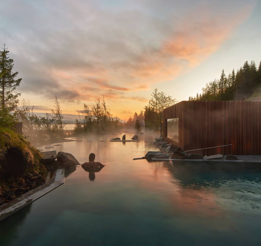 Steamy thermal pools at Forest Lagoon overlooking the fjord near Akureyri in North Iceland.