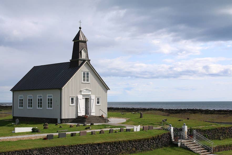The Strandarkirkja Church in Iceland is surrounded by beautiful countryside views