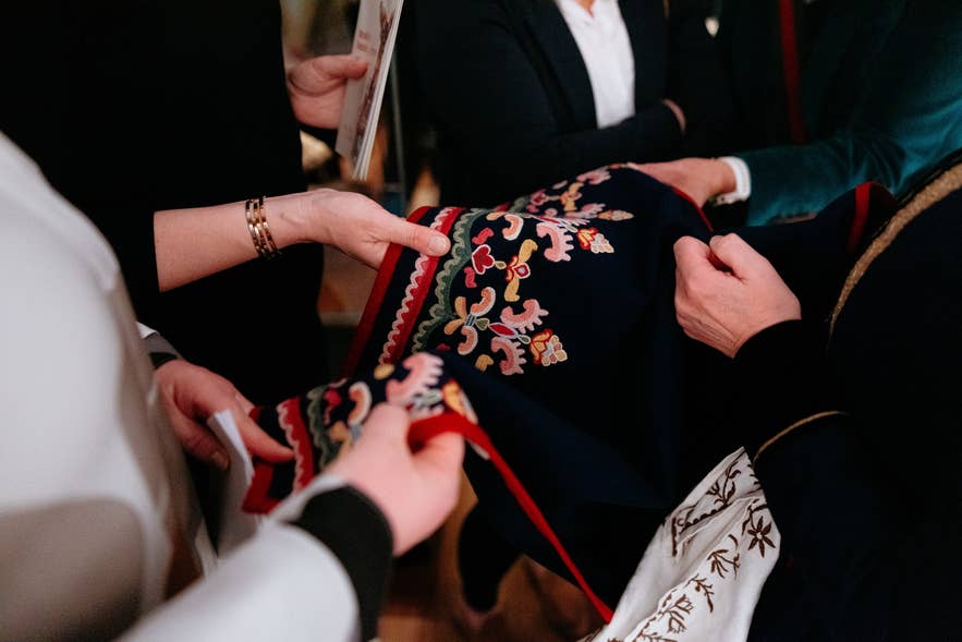 Close-up of traditional Icelandic embroidery on a þjóðbúningur displayed at the National Museum of Iceland
