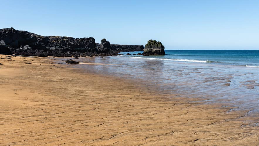 Sunny view of Skardsvik Golden Sand Beach in West Iceland, near the August 12, 2026 total solar eclipse path