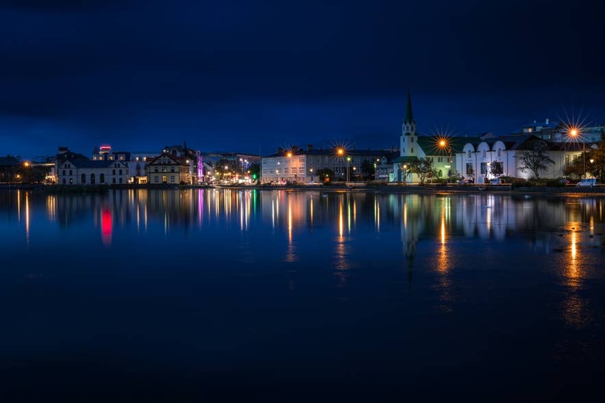 Lake Tjörnin in central Reykjavík, the capital of Iceland, at night.