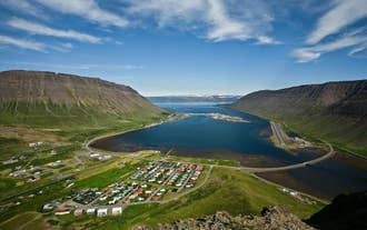 Aerial view of Isafjordur town spread along a fjord in the Westfjords of Iceland.