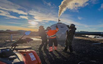 Group of adventurers visiting the Hellisheidarvirkjun Geothermal Power Plant in Iceland.
