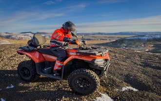ATV driver exploring the volcanic landscapes of the Hengill Geothermal Region.