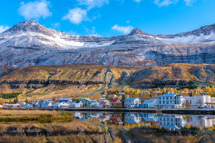 The colorful seaside village of Seydisfjordur with its blue church in East Iceland.