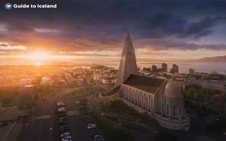 The sun sets over Reykjavik city, the starting point for many tours to discover Iceland's wonders.