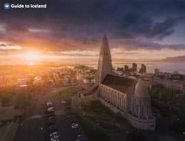 The sun sets over Reykjavik city, the starting point for many tours to discover Iceland's wonders.