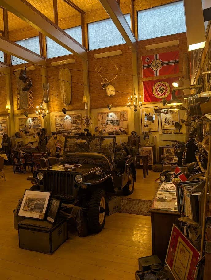 Vintage military jeep and wartime exhibits inside the War and Peace Museum. Vintage military jeep and wartime exhibits inside the War and Peace Museum.