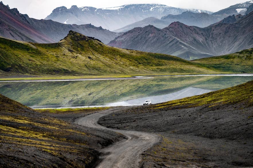 Scenic F-road crossing the Icelandic Highlands with mountain and lake views.