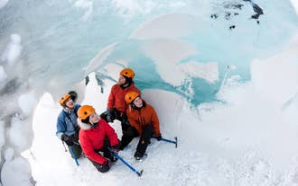 11 Hour South Coast Tour with Glacier Hiking, Waterfalls & Black Sands with Transfer from Reykjavik