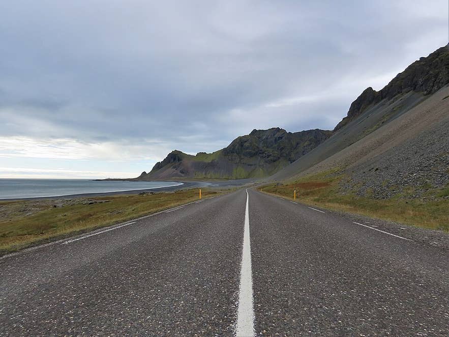 A paved stretch of Route 1 crossing Hlidarsandur in the Hornafjordur region of Southeast Iceland. A paved stretch of Route 1 crossing Hlidarsandur in the Hornafjordur region of Southeast Iceland.