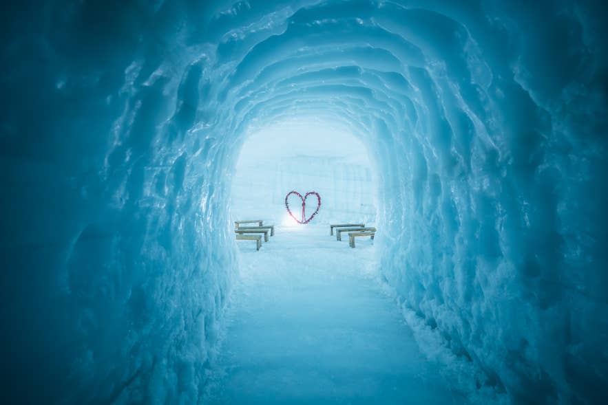 Blue ice walls of the man-made Into the Glacier tunnel in Langjokull on Arctic Adventures' tour from base camp.