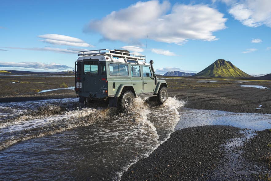 A 4x4 vehicle crossing the Icelandic Highlands.