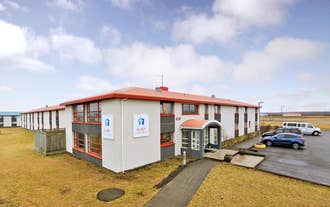 Red-roofed exterior of Airport Eldey Hotel near Keflavik International Airport in Iceland.
