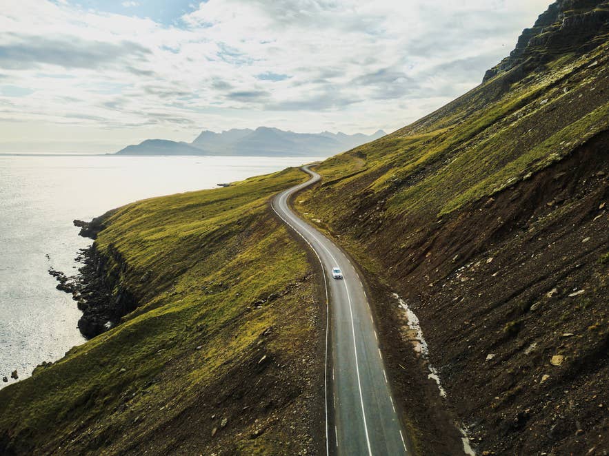 A rental car on an open Iceland road.