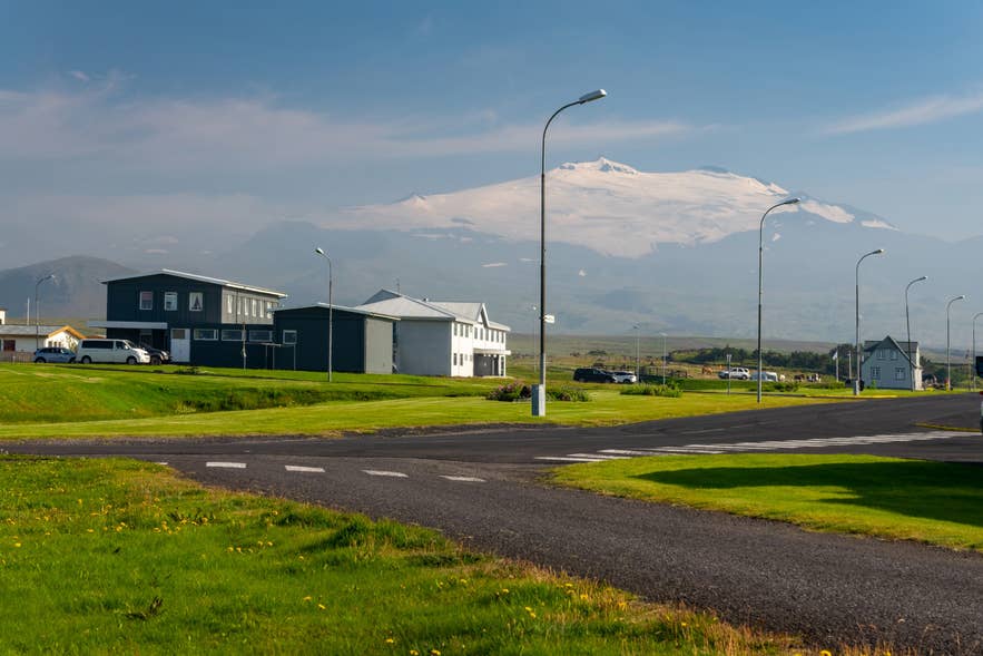 Street in Hellissandur Village with Snaefellsjokull rising in the distance.