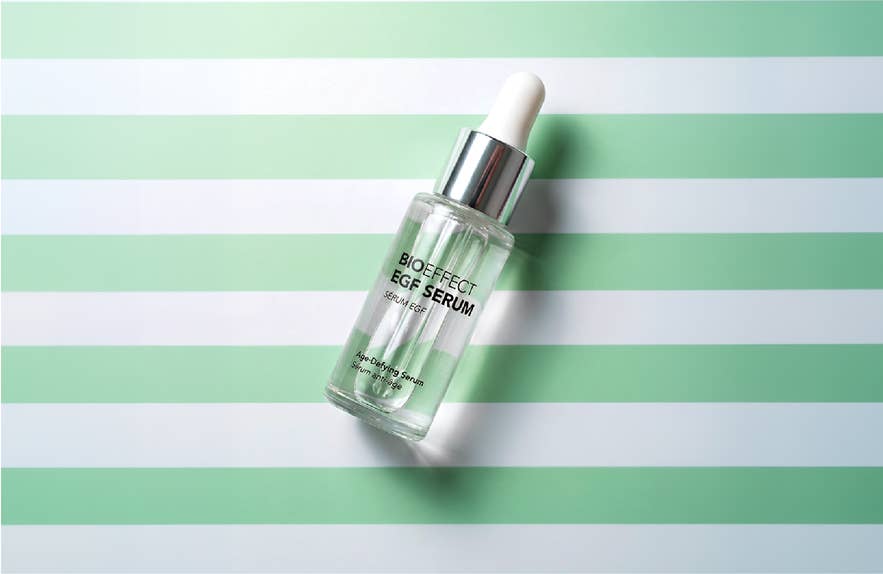 BIOEFFECT EGF Serum bottle with a dropper cap on a green and white striped background.