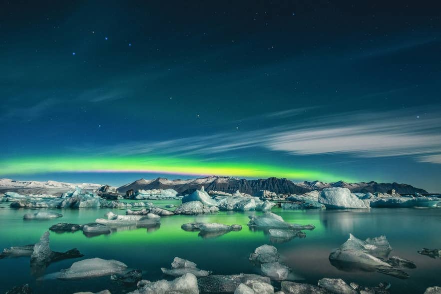 Northern lights above Jokulsarlon Glacier Lagoon and Breidamerkurjokull in winter