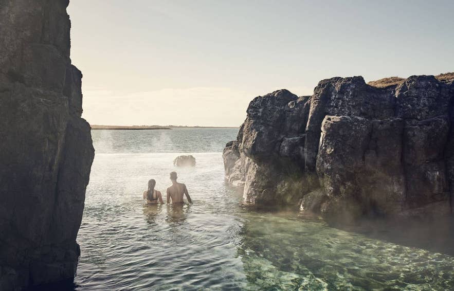 Guest relaxing in the geothermal waters of the Sky Lagoon in Iceland.