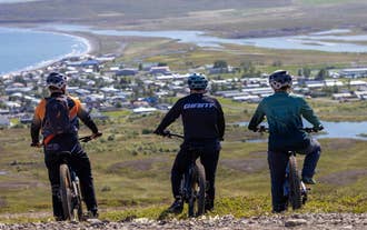 Riders overlooking Dalvik and Eyjafjordur before beginning their e-bike adventure.