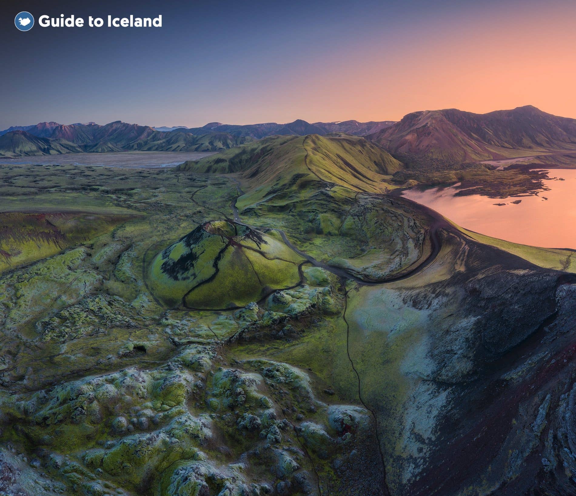 The moss-green Stútur crater and Frostastaðavatn lake glow at sunset in the Landmannalaugar area of the Highlands, Iceland.