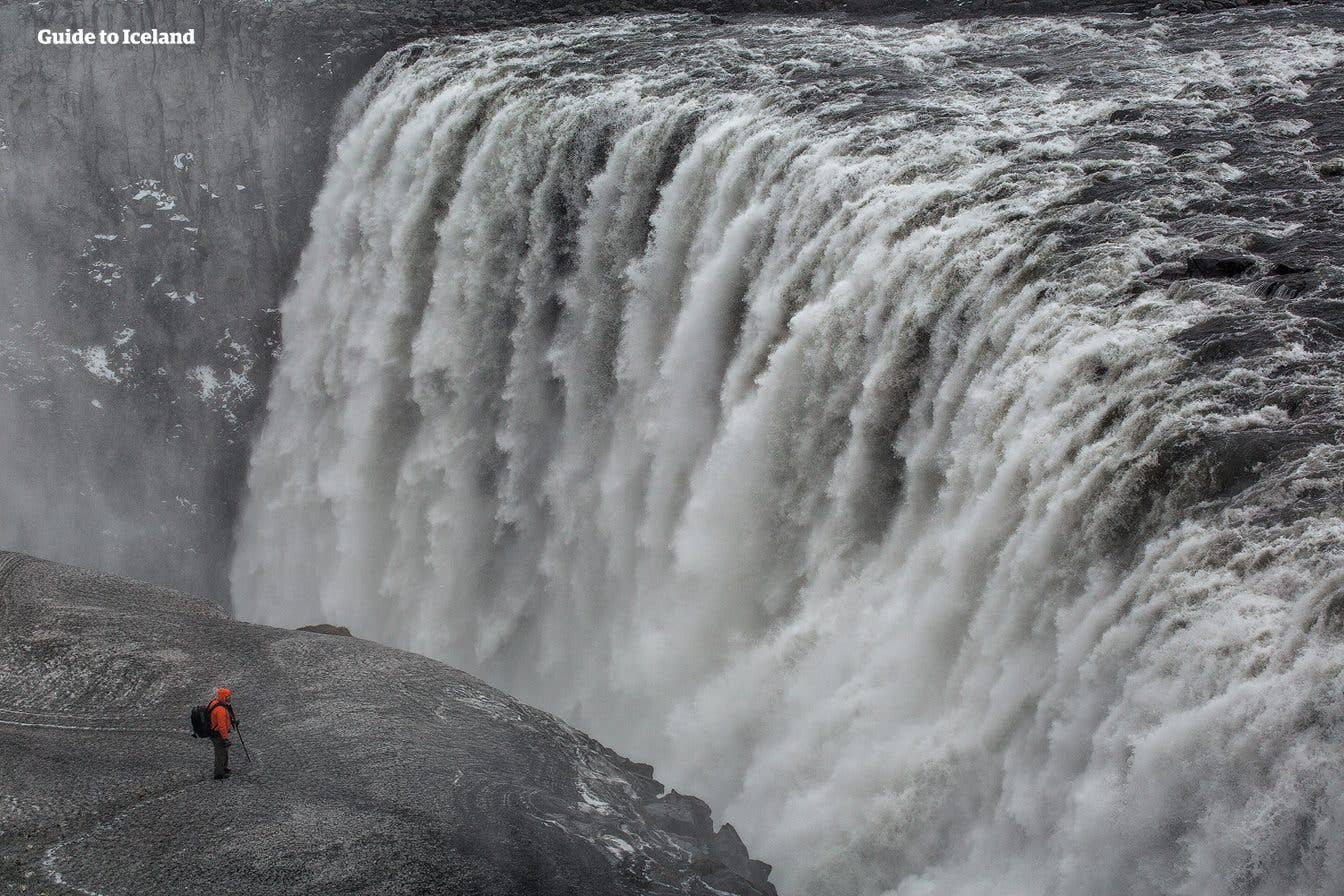 A tiny figure stands beside the thundering Dettifoss, Europe's most powerful waterfall, in northeast Iceland.