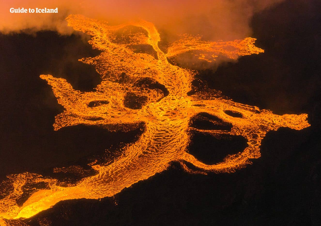 Glowing rivers of molten lava spread across the ground during the Holuhraun eruption in the Icelandic Highlands.