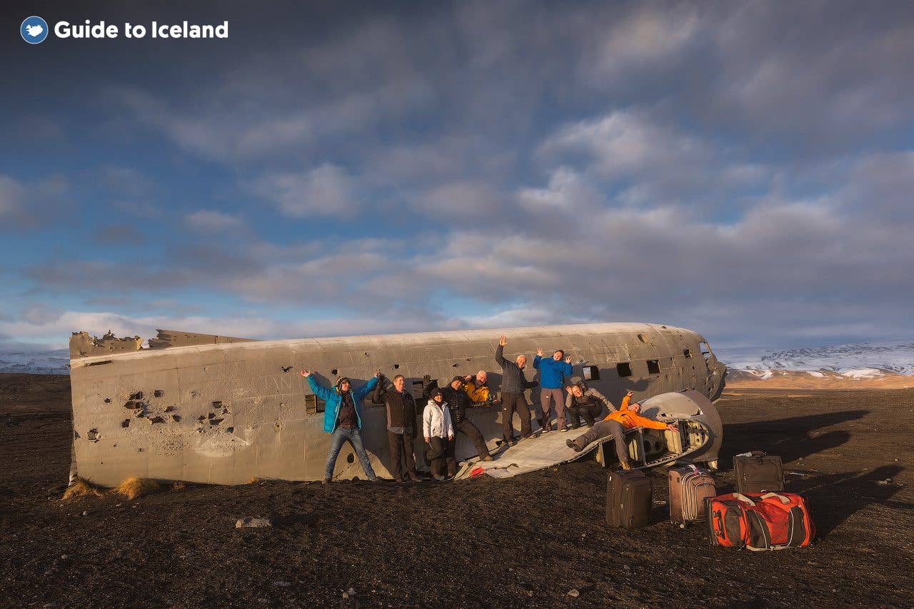 Visitors gather around the DC-3 plane wreck on the black sands of Sólheimasandur on the south coast of Iceland.