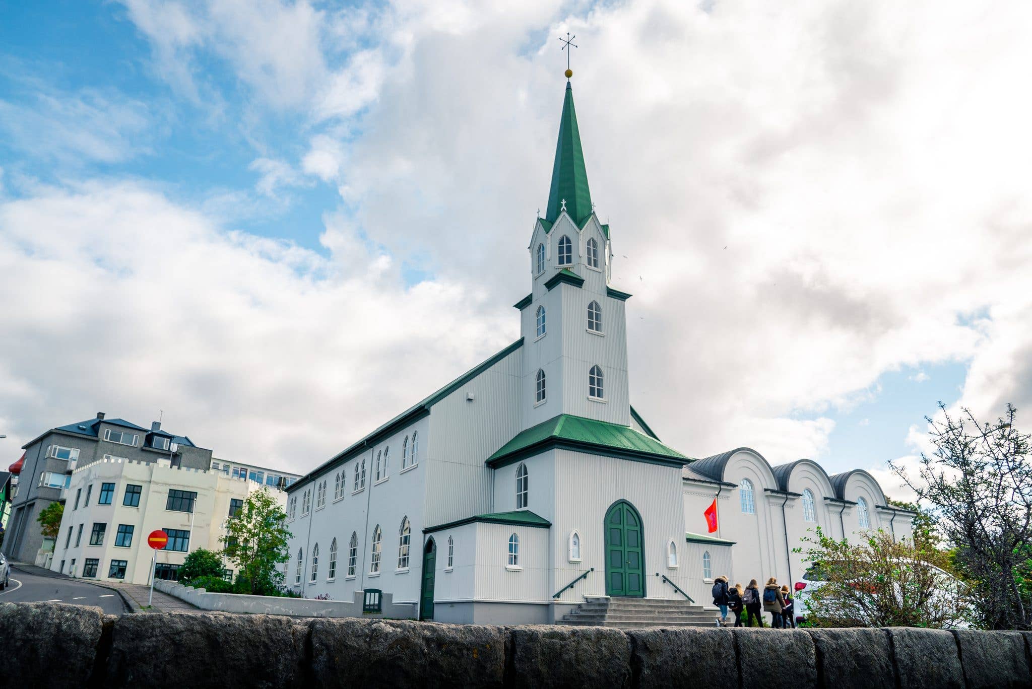 The Fríkirkjan church stands under a bright summer sky in central Reykjavík, Iceland.