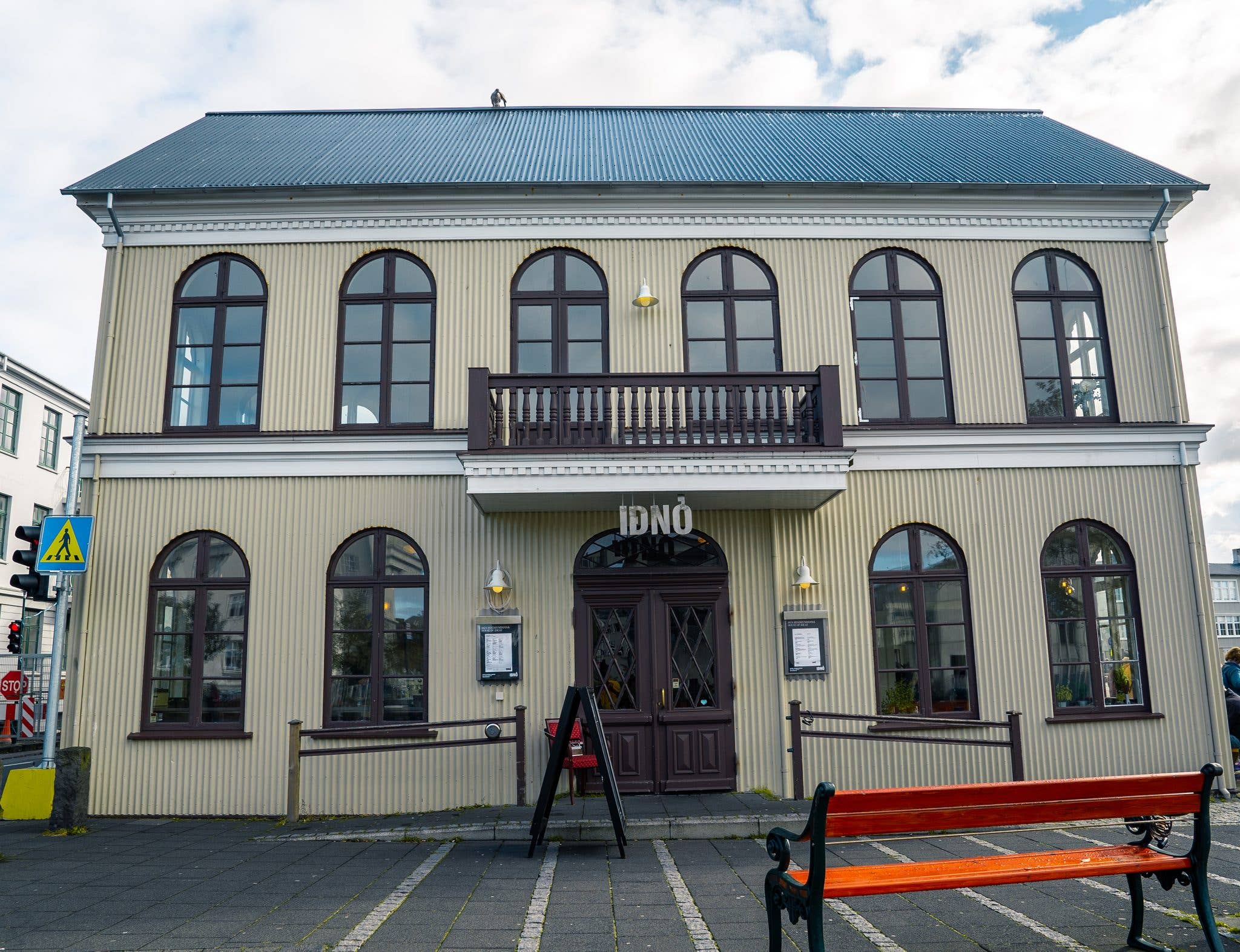 The historic Iðnó theatre house sits by the pond in the old town of Reykjavík, Iceland.