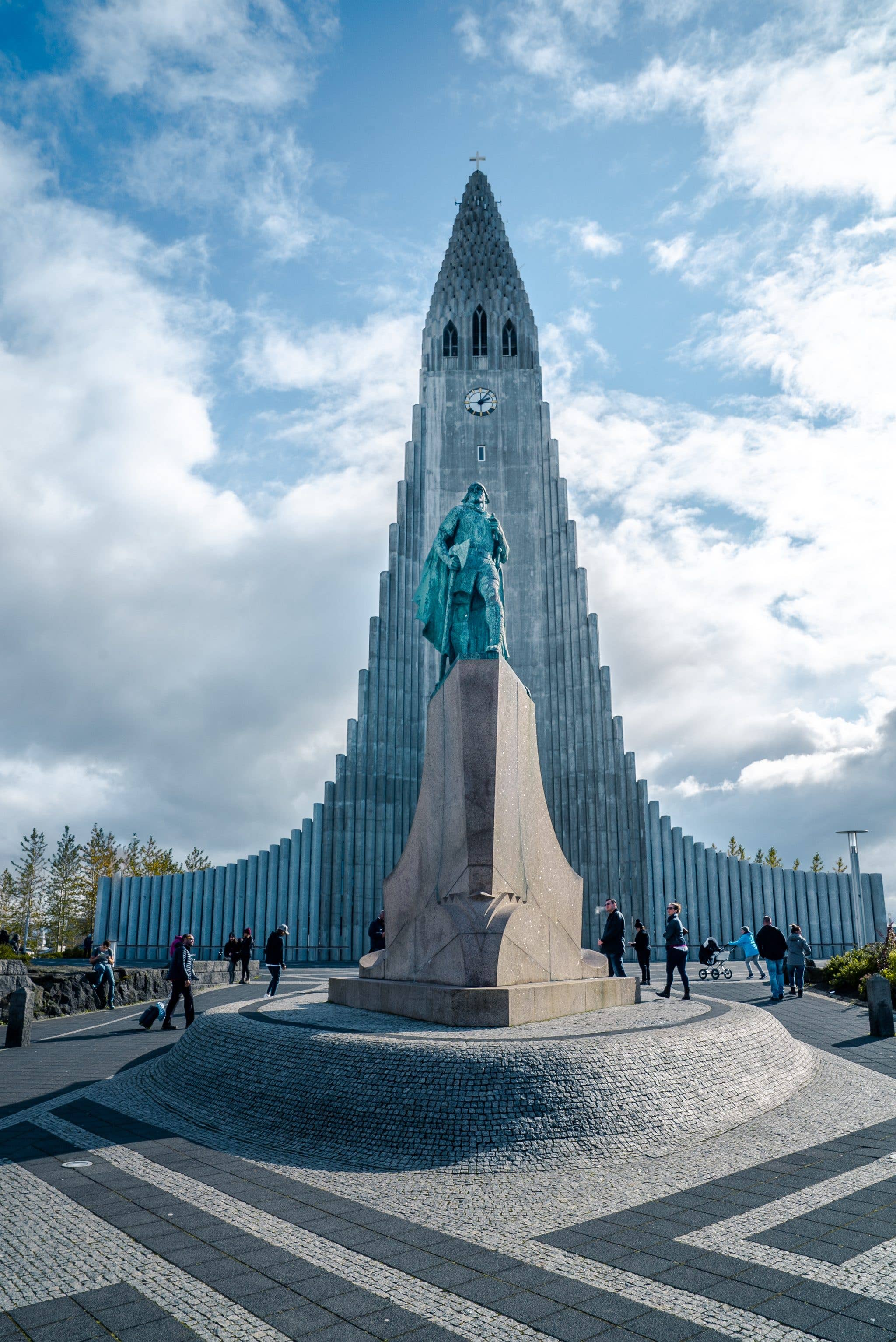 The Hallgrímskirkja church and the statue of Leif Erikson stand under a bright sky in Reykjavík, Iceland.