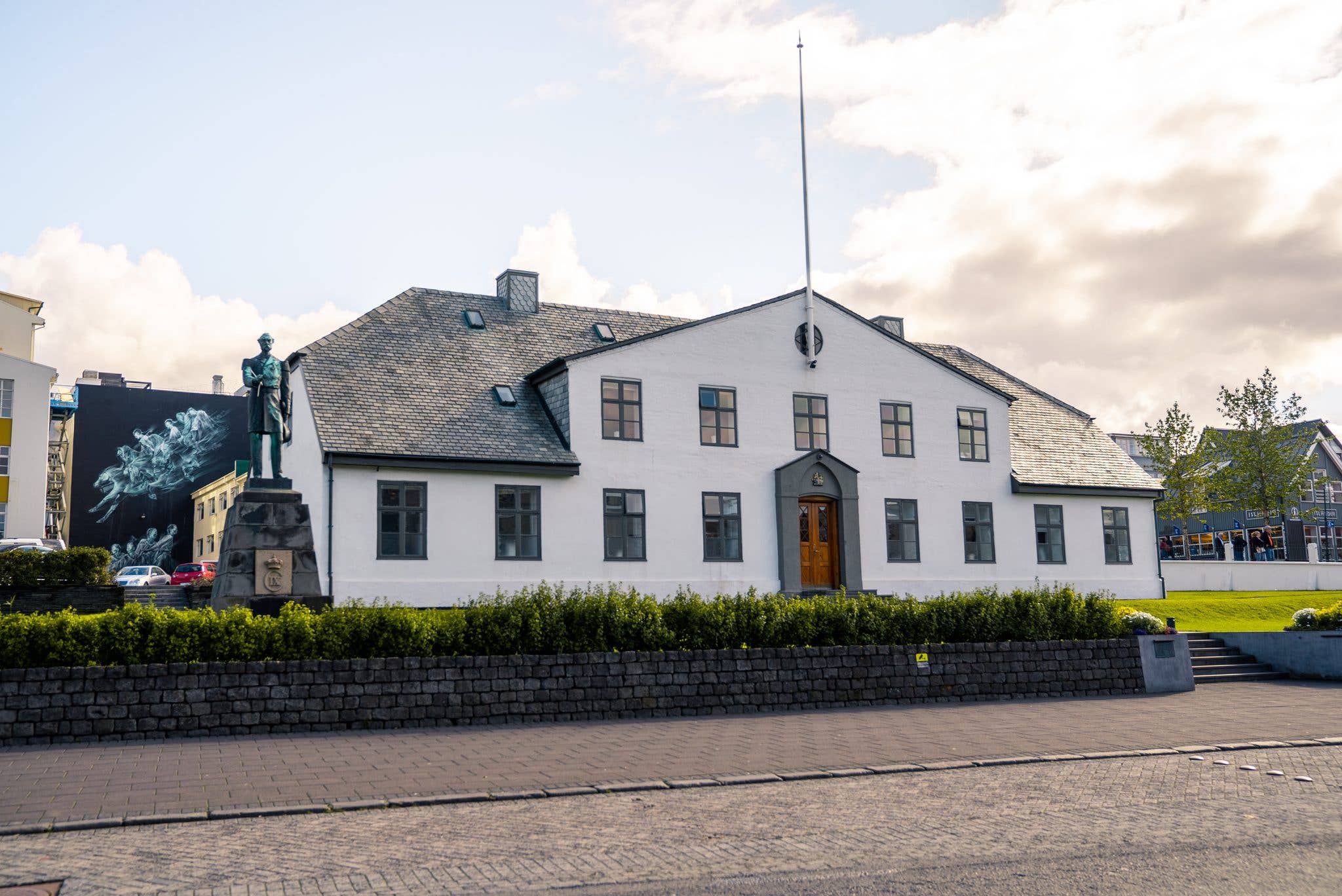 The Stjórnarráðið government house and a sculpture stand in central Reykjavík, Iceland.